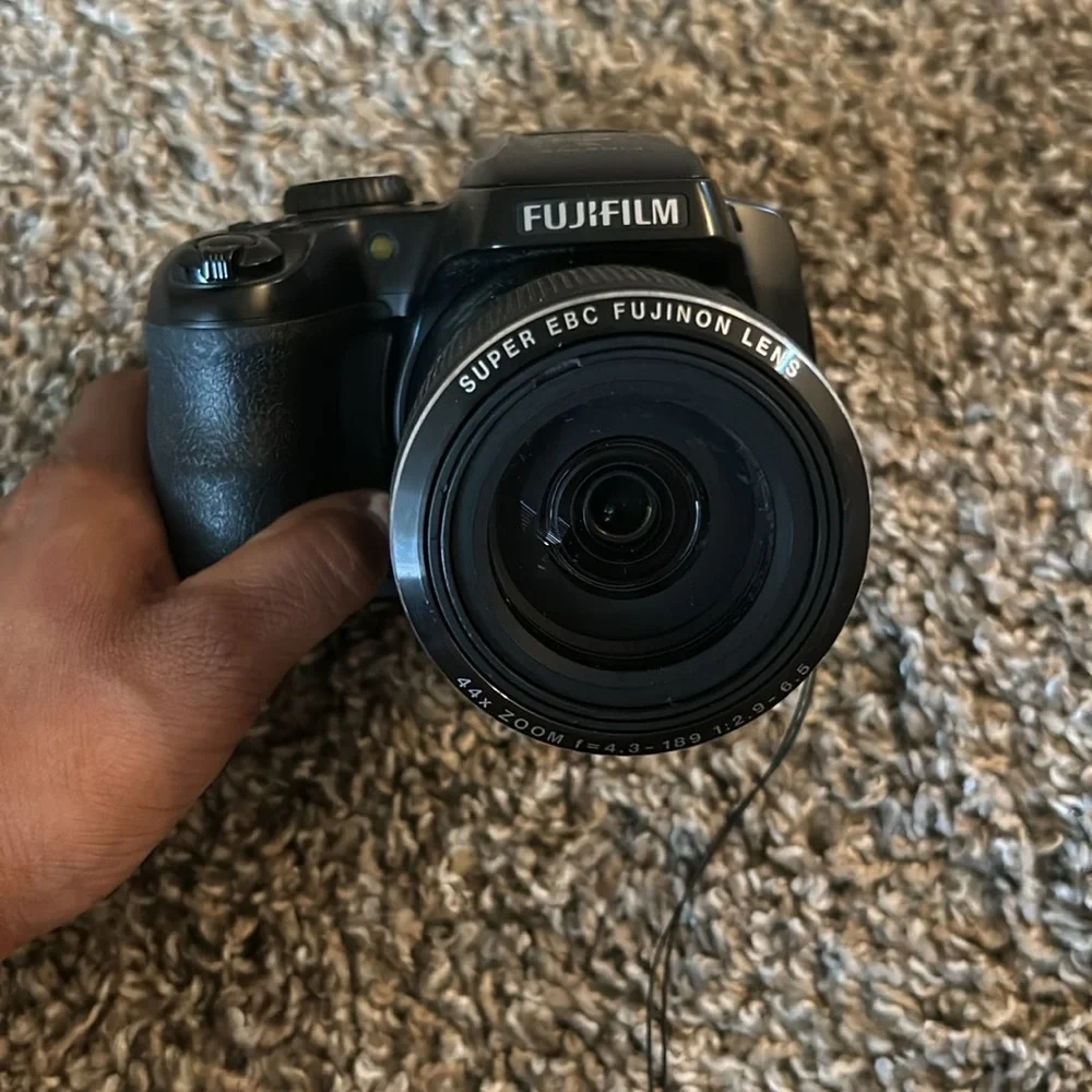 CAMERA Brand:Fuji-film color: Black and it’s digital.
